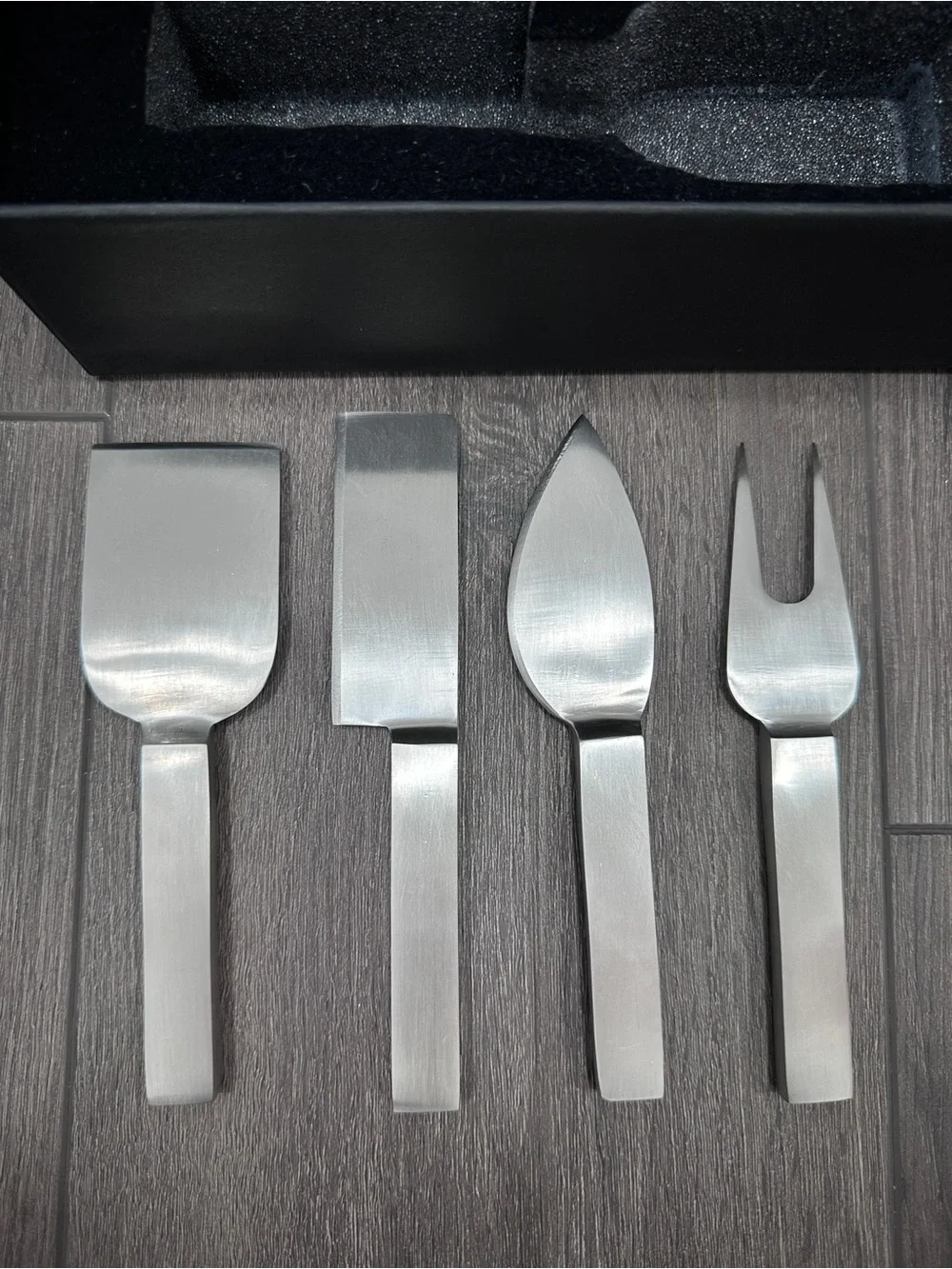 Calvin Klein stainless steel cheese serving set by Calvin Klein Home collection.